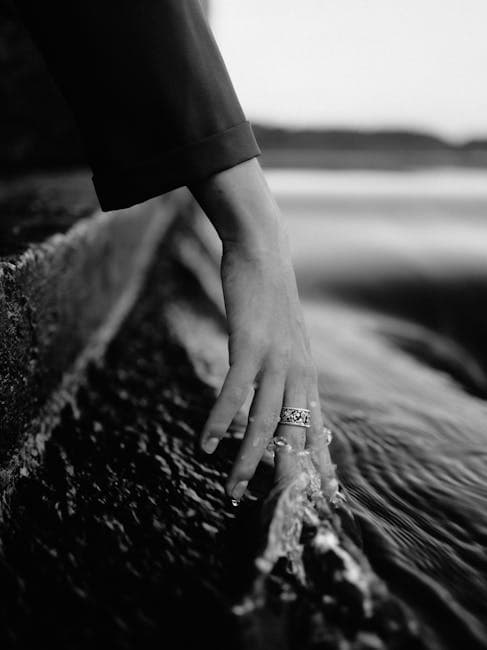 Womans Hand in Water in Black and White 