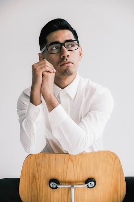 Man in White Shirt Sitting Backwards on Chair