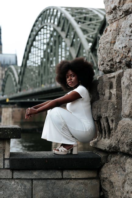  Woman sitting on a wall