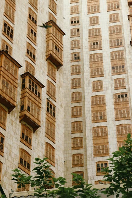 A tall building with many windows and balconies