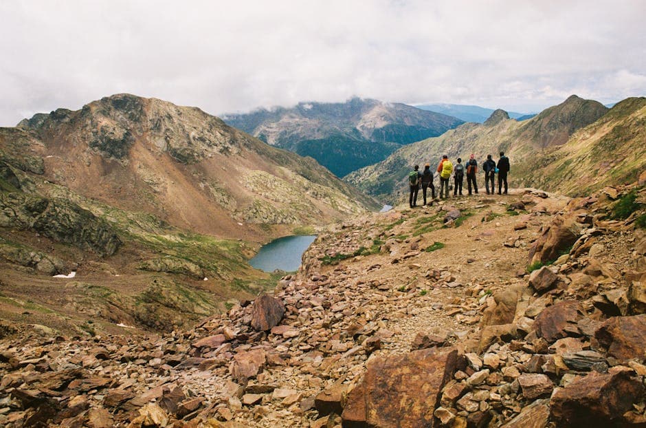 A group of people standing on top of a mountain