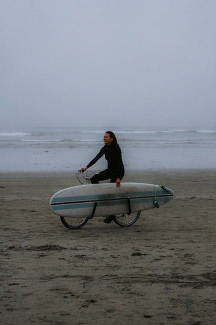 Woman Riding Bike with Surfboard