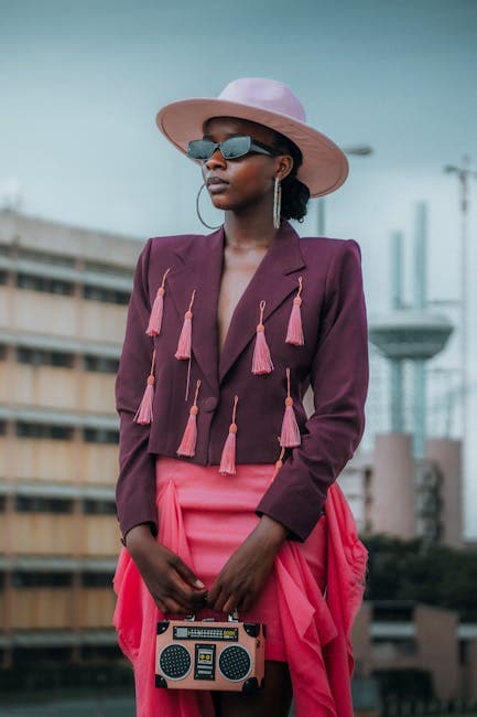 Elegant Woman Posing Wearing Pink Hat Purple Jacket and Neon Pink Skirt