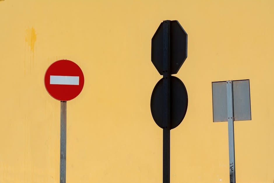 A group of traffic signs and no parking signs