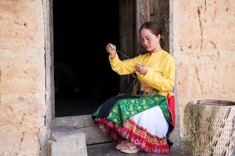 A woman sitting on the floor in front of a door