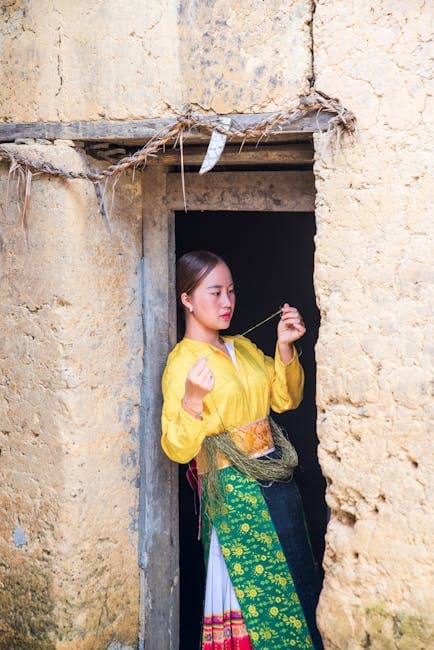 A woman in traditional clothing standing in a doorway