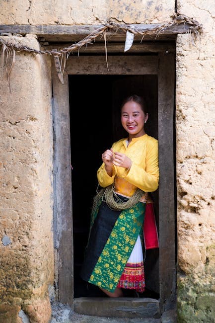 A woman in traditional clothing standing in a doorway