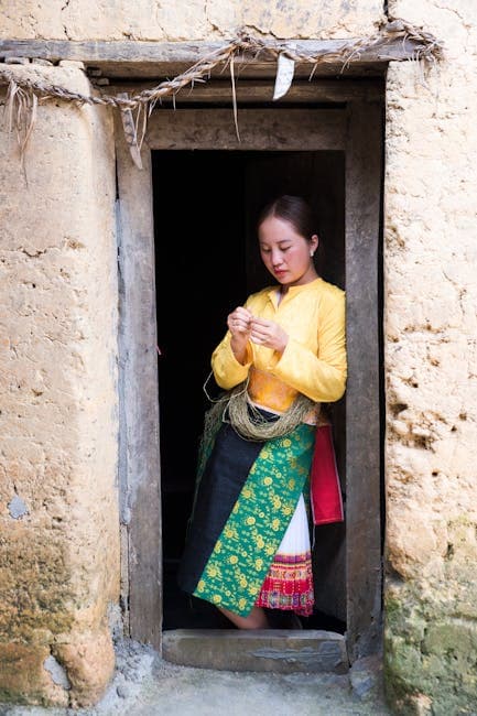 A woman in traditional clothing standing in a doorway