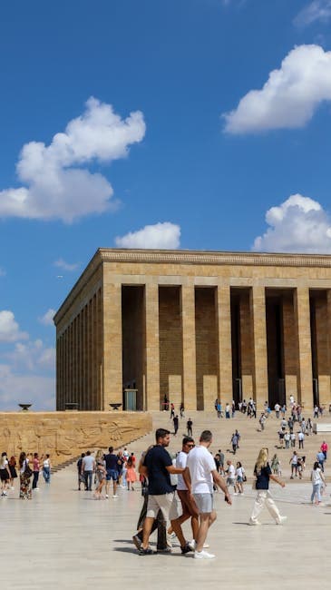 People walking in front of a large building