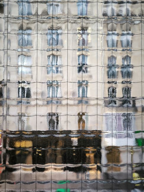 A reflection of a building in a window