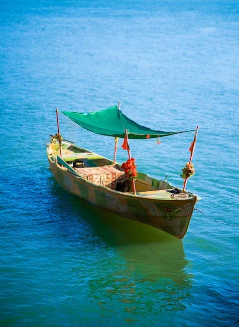 View of a Wooden Boat on the Body of Water 