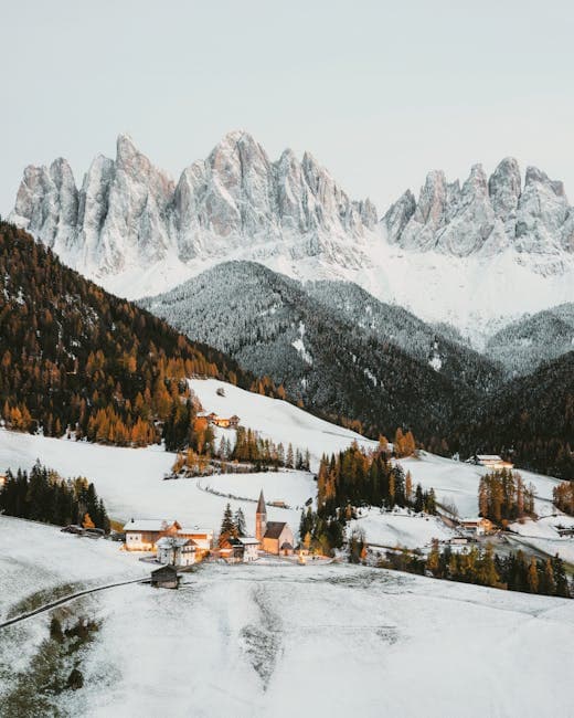 Aerial View of a Snowy Val di Funes Valley in the Dolomites in Italy 