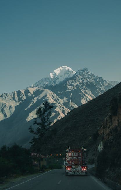 Tanker Truck Driving Along a Mountain Road