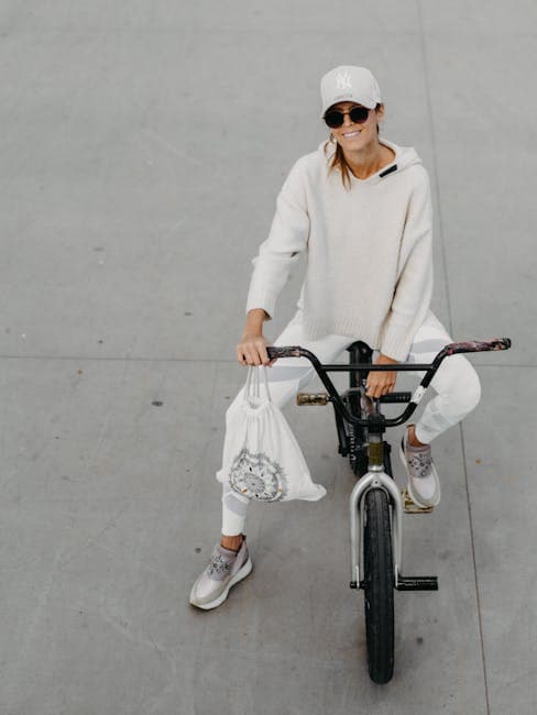 Smiling Woman Sitting on BMX Bike