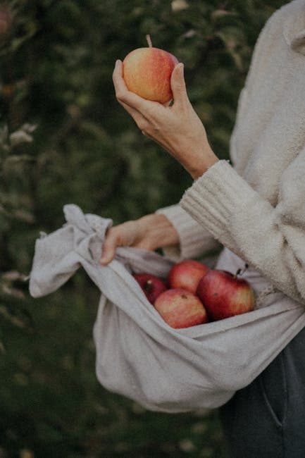 A Woman Holding an Apple