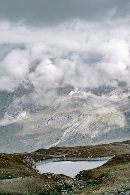 Cloud over Lake in Valley in Mountains