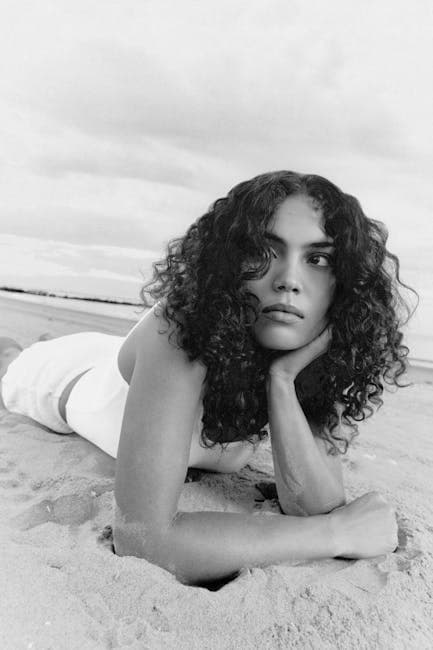 Brunette Woman Lying Down on Beach