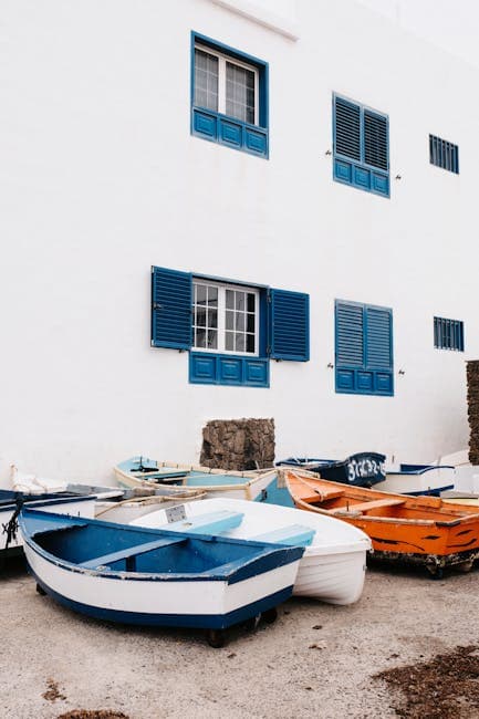 Boats Lying by House