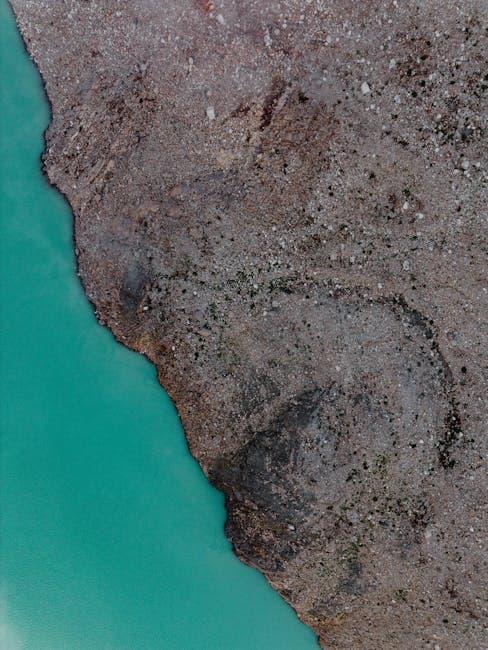 Aerial View of the Rocky Shore of a Mountain Lake