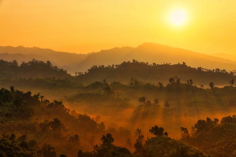 Golden Sky over Hills in Countryside at Sunset