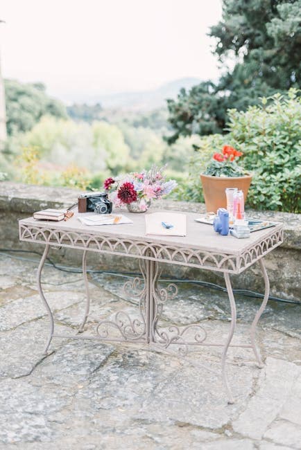 Table with Flowers and Camera on Stone Terrace