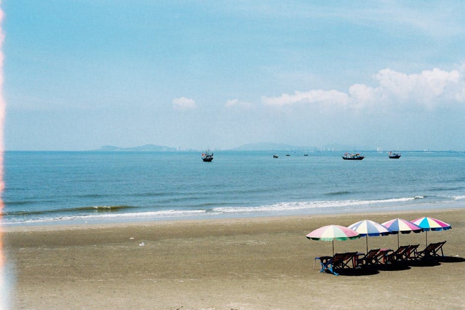 Beach by the Sea with Colorful Umbrellas