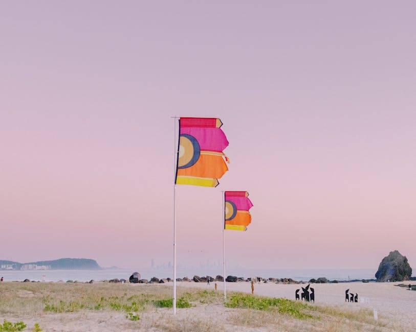 Colorful Flags on the Beach at Sunset