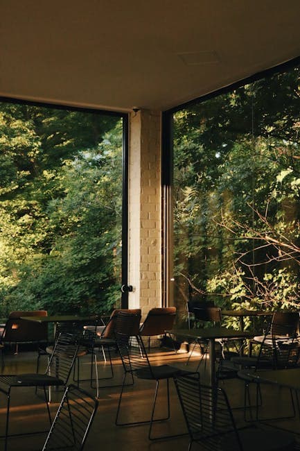 Chairs and Tables in Cafe with Large Windows