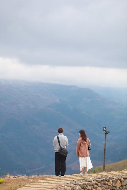 Man and Woman on Trail on Hill