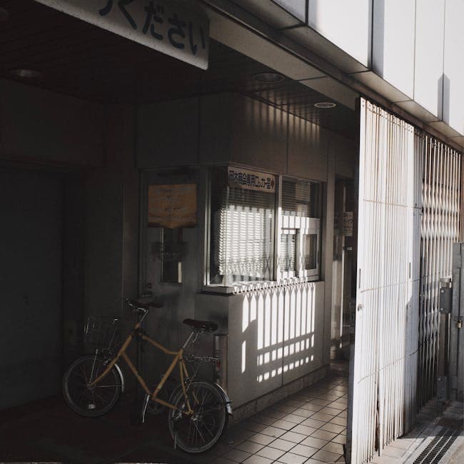 A bicycle parked outside of a building