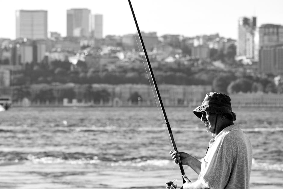 Fisherman in Istanbul with City Skyline