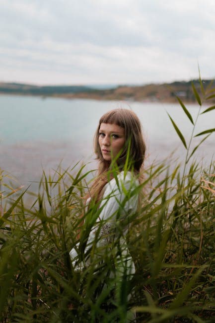 Portrait of woman by a tranquil lakeside setting