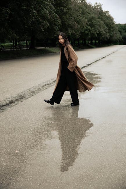 Stylish Woman Walking on Rainy Day Reflection