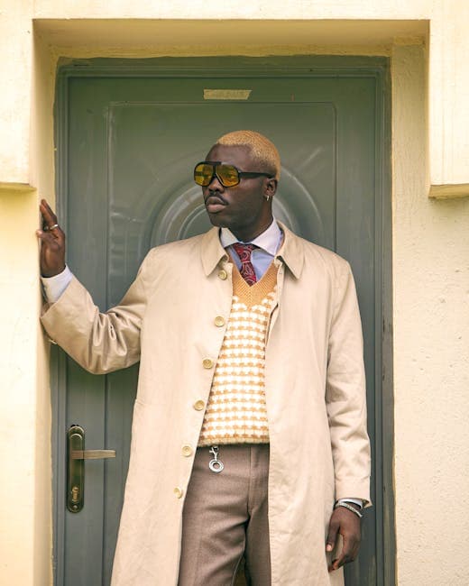 Stylish Man in Beige Trench Coat by Doorway