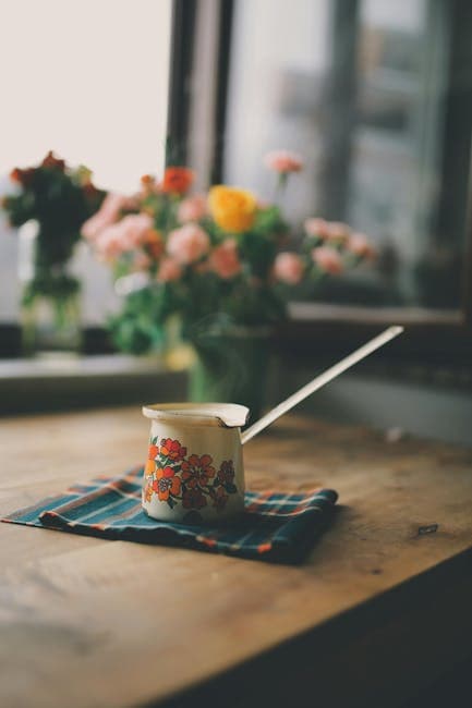 Vintage Floral Pot on Rustic Wooden Table