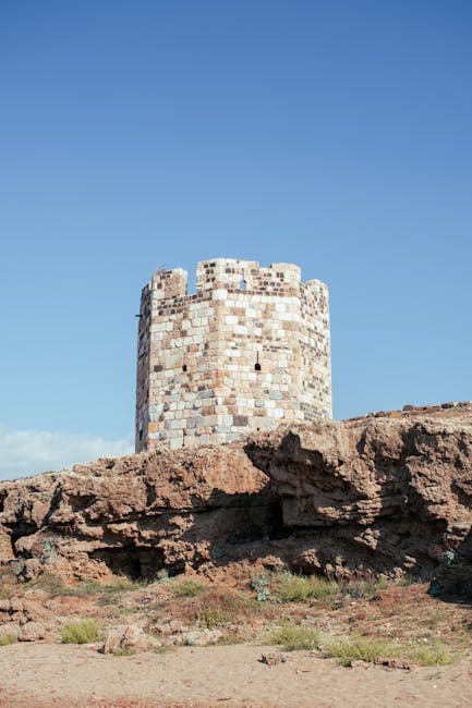 Ancient Stone Tower on Rocky Cliff