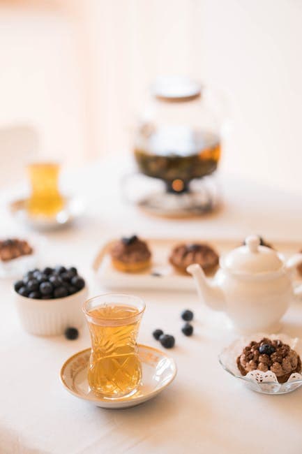 Elegant Tea Setting with Blueberries and Pastries