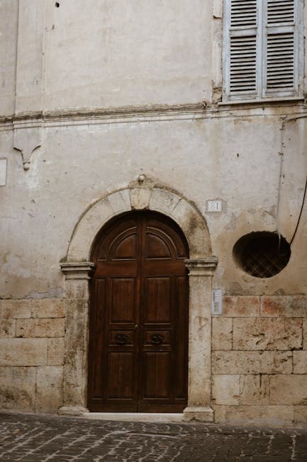 Historic Wooden Door on Aged Stone Building