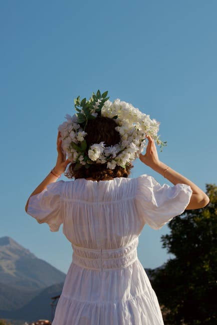 girl in a field against the backdrop of mountains