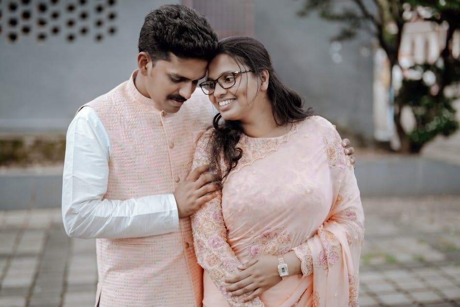 Happy couple embracing outdoors in elegant attire