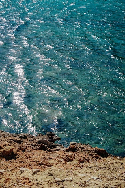 Crystal Clear Turquoise Sea Along Rocky Coastline