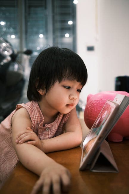 Child Engaged With Tablet Indoors