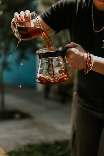 Pouring Fresh Coffee Outdoors in Sunlit Garden