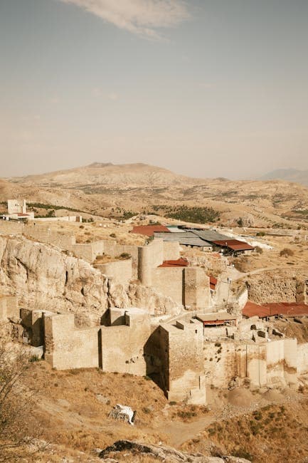 Ancient Mountain Fortress Ruins in Desert Landscape