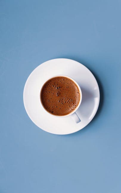 Minimalist Overhead Italian Coffee on Blue Surface