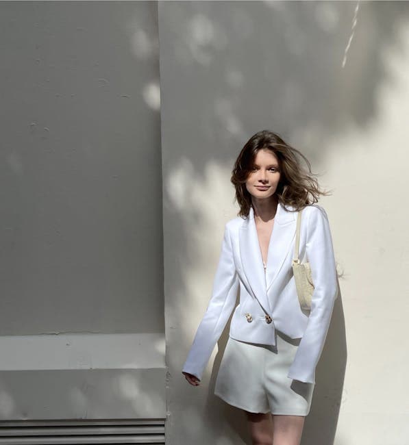 Stylish Woman in White Blazer Outdoors