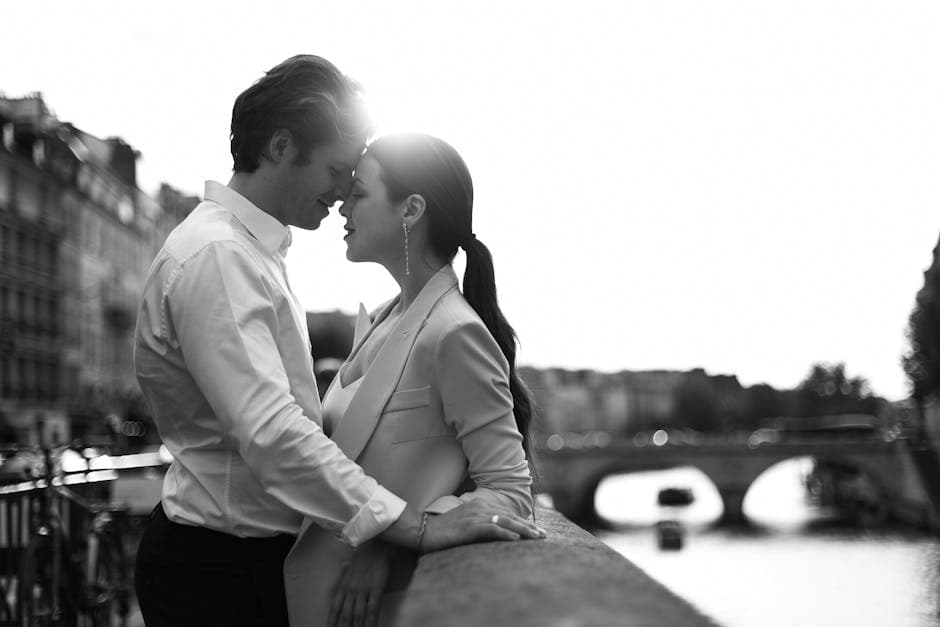 Romantic Couple Embracing on a Paris Bridge